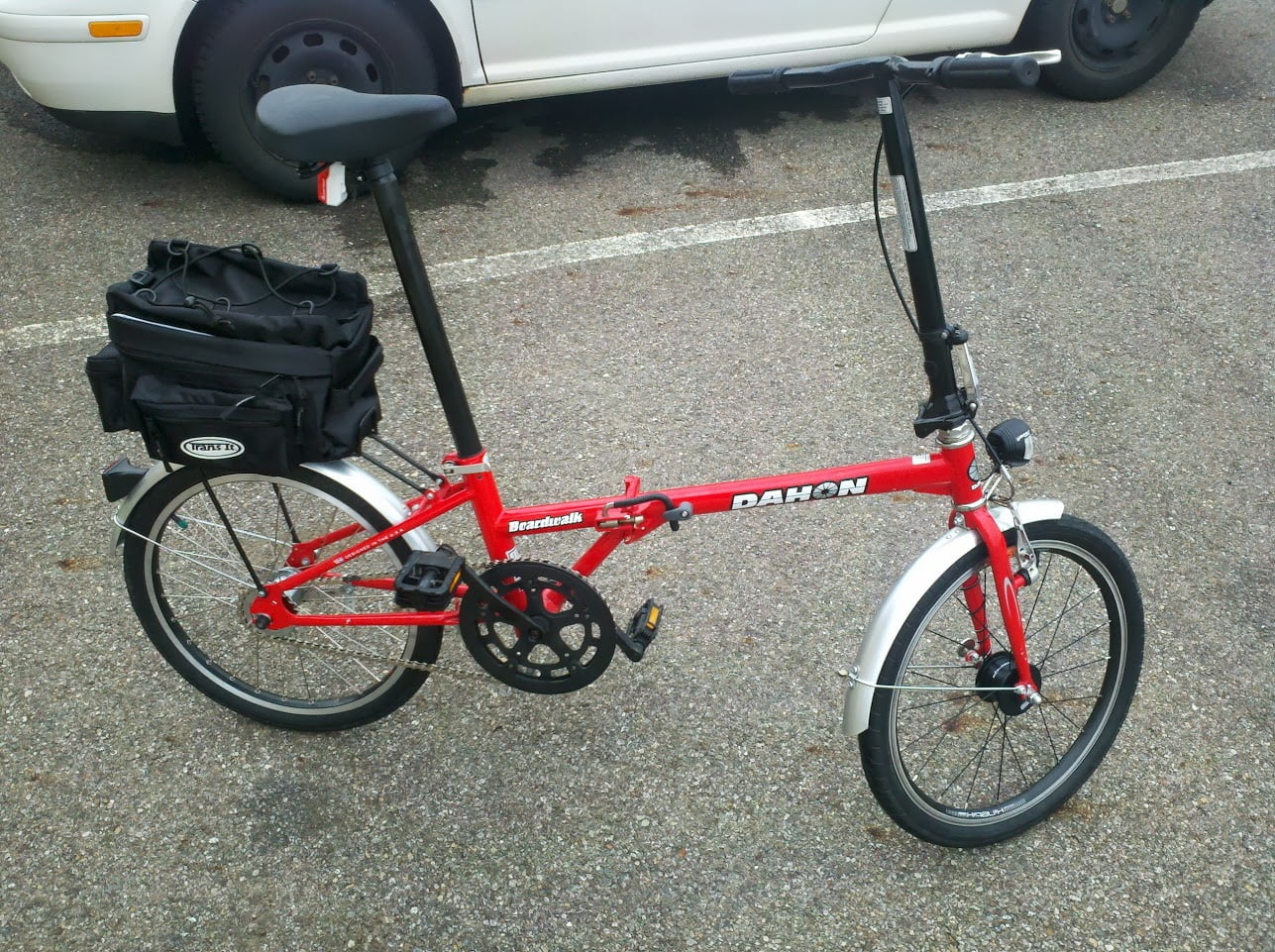 Folding bicycle. Wheels are small like on a kid's bicycle, but a full grown man can comfortably sit on this one. Seating position is upright, for slow urban riding.