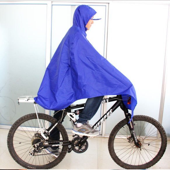Poncho rain coat. Covers head, knees, most of the body.
