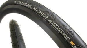 Tread pattern on a popular model of road tyre is so shallow and small that it almost doesn't harm the traction. Note that the middle, part that comes in contact with the pavement is totally tread free - 100% slick.