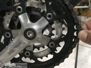 Worn chain can be pulled off the largest chainring so a whole tooth is shown.