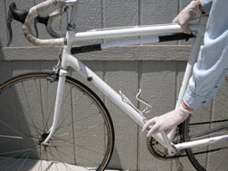 Shifting gears when off the bicycle: The rear is lifted with one hand, while pedals are turned with the other. Switch one or two gears with a shift lever, then spin the wheel so that the shift is performed (chain moved). Repeat until the chain is on smallest chainrings. First at the rear, then at the front.