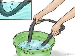 Placing a tube in a bucket with still water, bubbles will appear in a place where the puncture is.