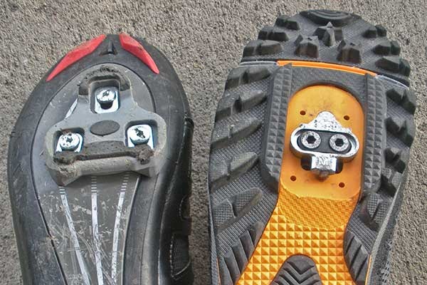 Left - shoe with road clip. Right - shoe with MTB clip.