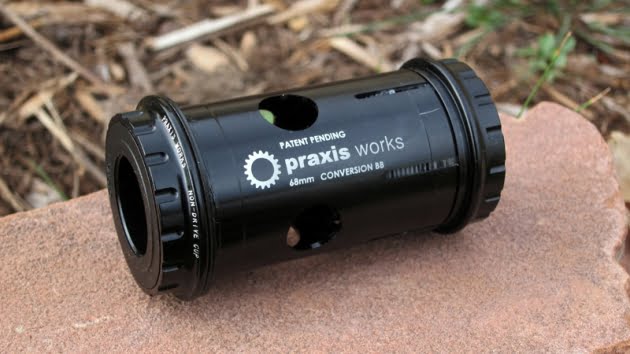 Praxis Works' adapter to fit 24 mm spindle diameter cranksets in a PF30 compatible frame cartridge shell.