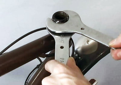 Fastening lock nuts holding a threaded fork in place. Source: bicycletutor.com Picture 3