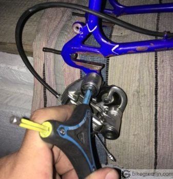 Screweing a direct mount rear derailleur onto a frame (which has a hook with a threaded hole for screwing the derailleur onto).