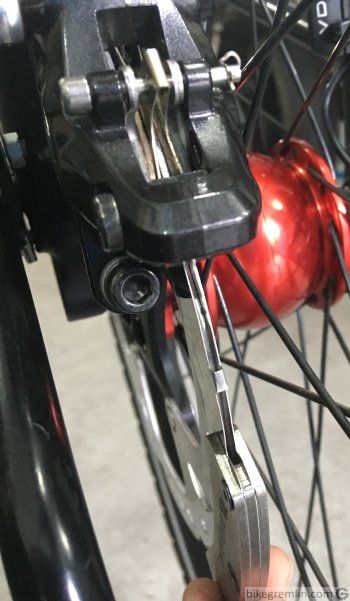 Inserting disc brake alignment tool