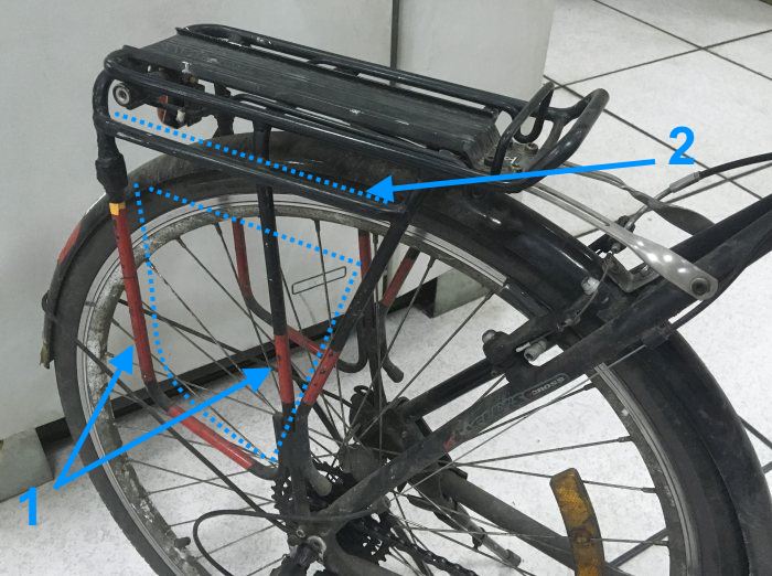 Bicycle rear rack suitable for both panniers and backpack mounting. 1 - pannier side support 2 - lowered rail for "hanging" the panniers Picture 1