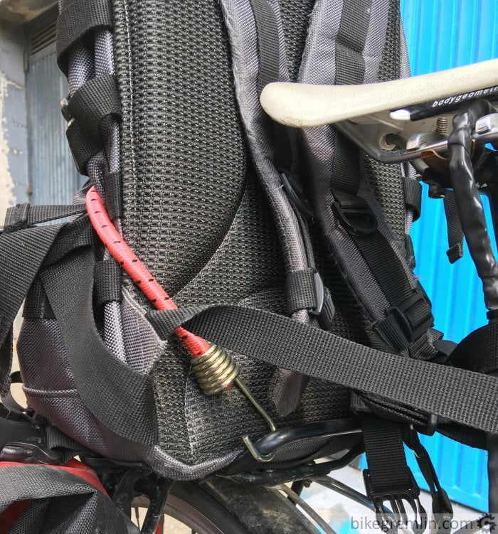 backpack on rear bike rack