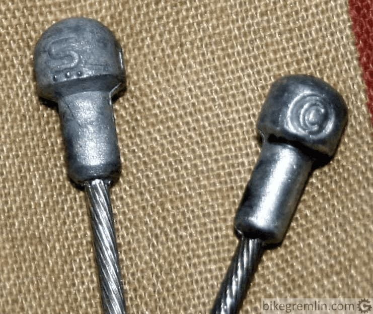 Road bike brake cable ends for Shimano (left) and Campagnolo (right)