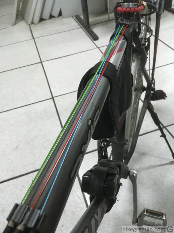 Example of crossed cable routing. Green: front derailleur cable. Blue: rear derailleur cable. Red: (rear) brake cable.