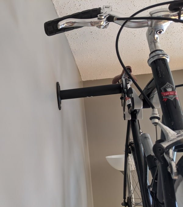 How it looks from the wall side - bicycle is held at a sufficient distance to prevent pedal, or handlebars from staining the wall
