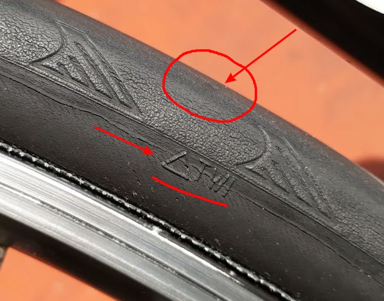 An example of an almost completely worn tyre wear indicator