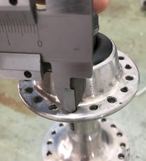 Measuring spoke hole diameter on a hub flange