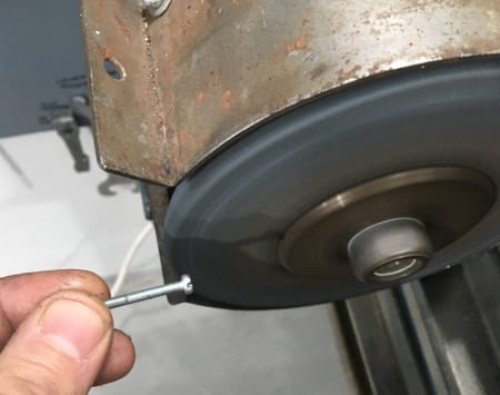 Grinding the screw heads