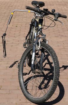 A bicycle with a dog-cycling spring attached