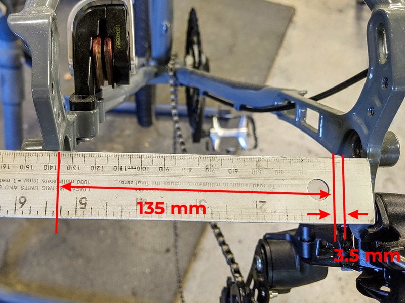 142 mm hub frame - has 3.5 mm "steps" on each side to hold the hub seated in place (135 + 3.5 + 3.5 = 142)