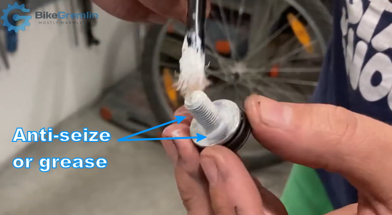 Smear anti-seize paste (i.e. mounting paste) or grease on both the threads and the "face" (i.e. under head) of the mounting bolt