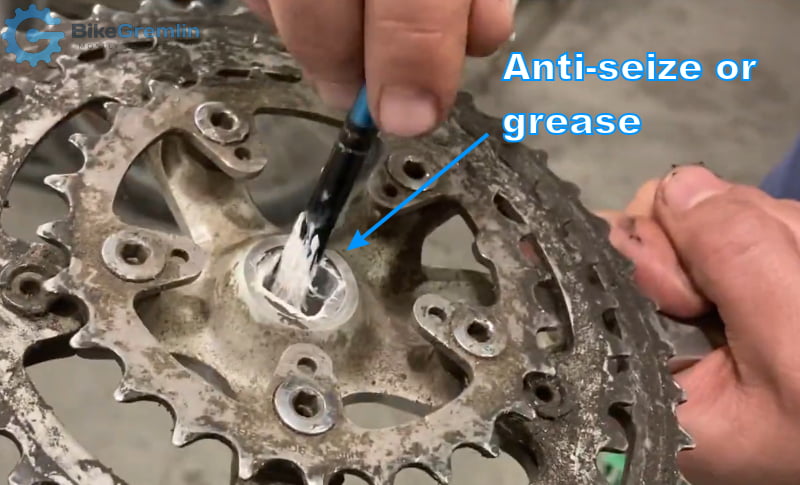 Smear some anti-seize paste (or grease) on the crank's interface that goes over the spindle (just to be on the safe side, even though lubing the spindle alone should suffice)