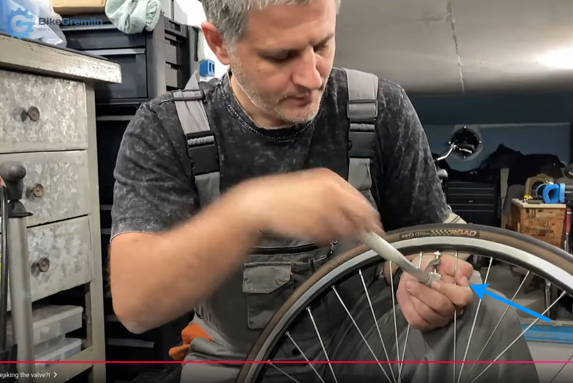 Supporting the pump's head with my hand and knee while pumping a presta valve