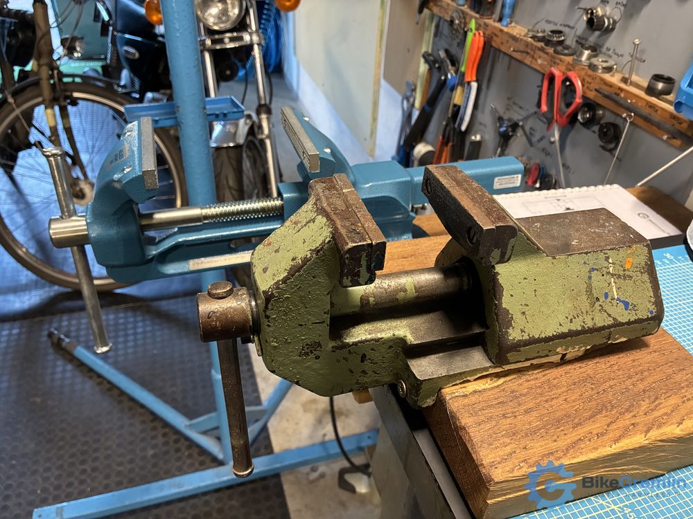 Front (green) my workshop's first, old vice